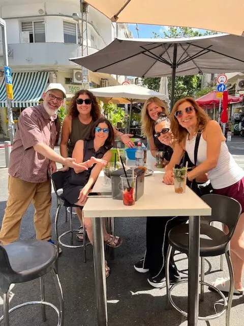 Enjoying Burekas Penso on the Levinsky Market food tour with Harry Rubenstein in Tel Aviv.