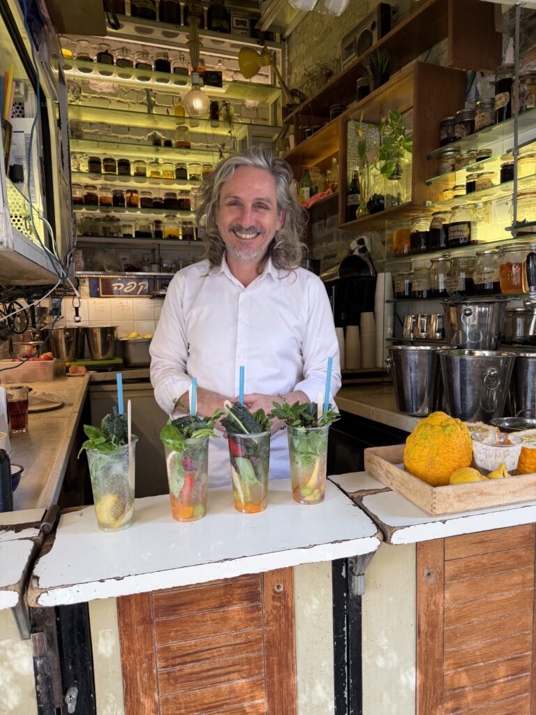 Benny Briga, owner of Café Levinsky 41, making gazoz at his kiosk in Levinsky Market, Tel Aviv