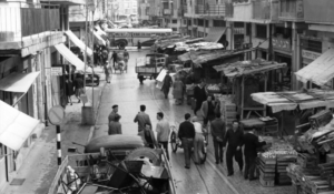 Levinsky Market in Tel Aviv during the 1960s, showing early delicatessens and street life in the historic market district.