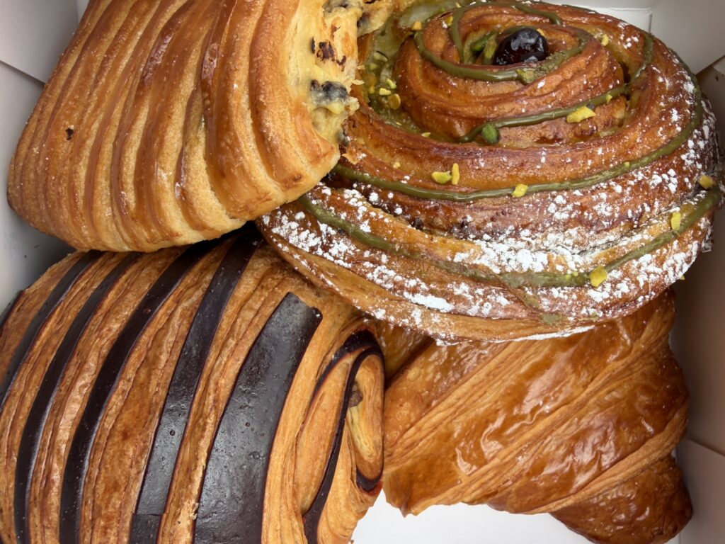 French pastries including canele and croissants at Patachou Boutique bakery near Mahane Yehuda Market.