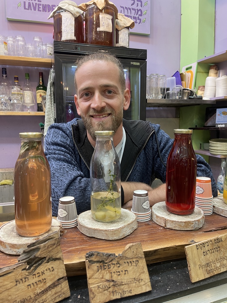 Cold-pressed herbal drinks at Infused JLM juice bar in Mahane Yehuda Market, Jerusalem.