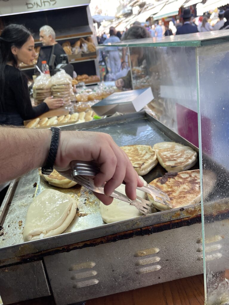 Kurdish kadeh grilled cheese flatbread at Duvshanit Kadeh bakery near Mahane Yehuda Market, Jerusalem.